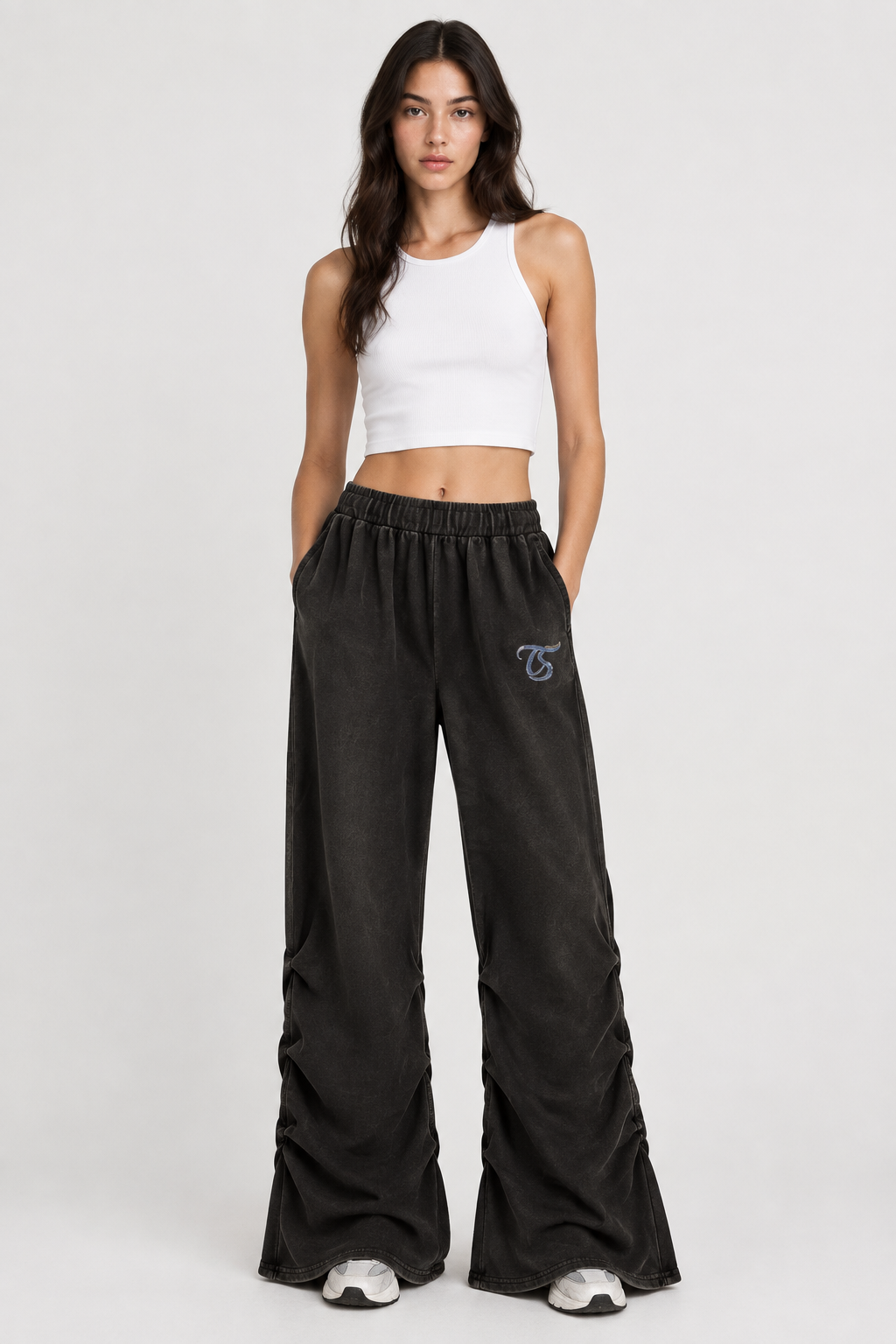 Female model front view of Aries ruched sweatpants