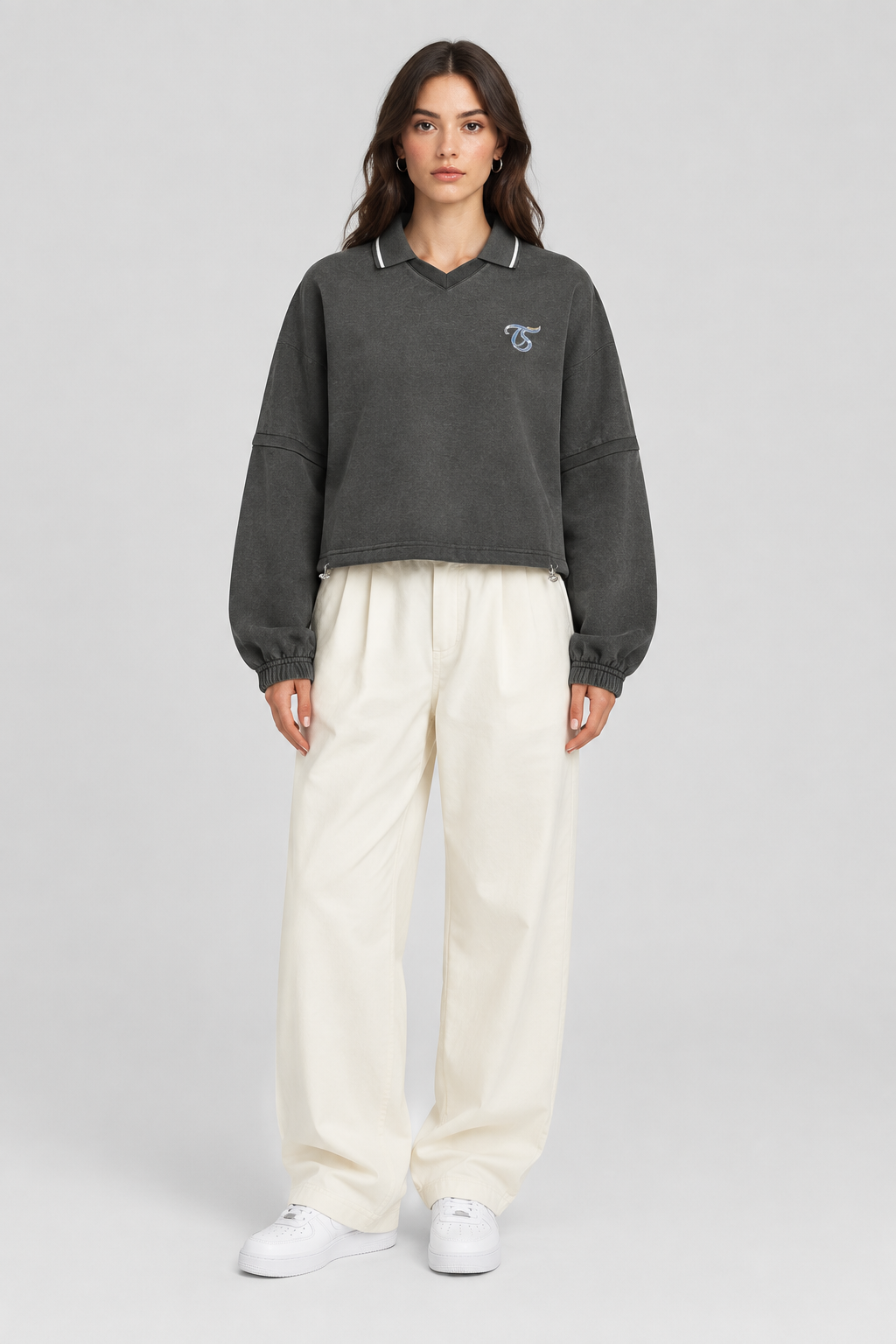 Female model wearing Libra unisex boxy collared detachable sweatshirt, front view; illustrative styling image