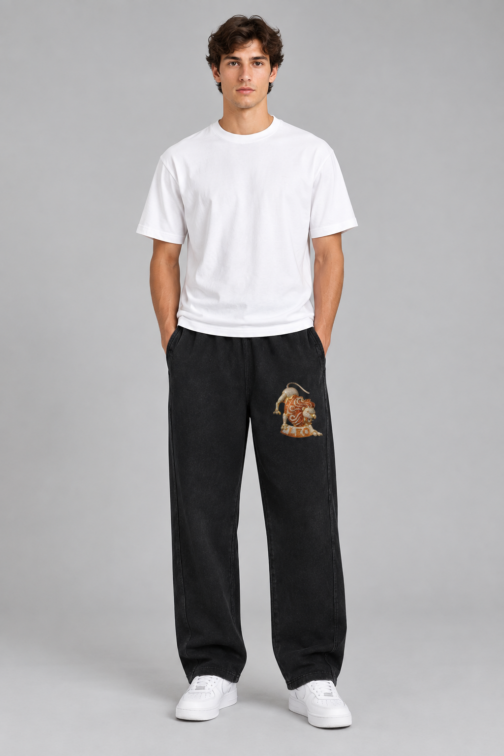 Male model wearing black Leo mineral wash straight sweatpants, front thigh lion design; illustrative print