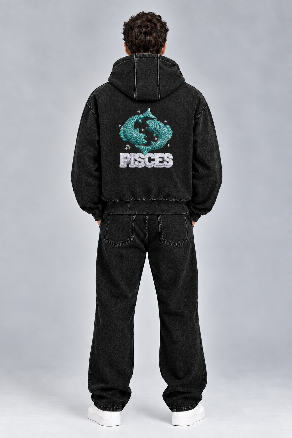 Male model wearing black Pisces vintage wash full zip hoodie, back view; print is illustrative