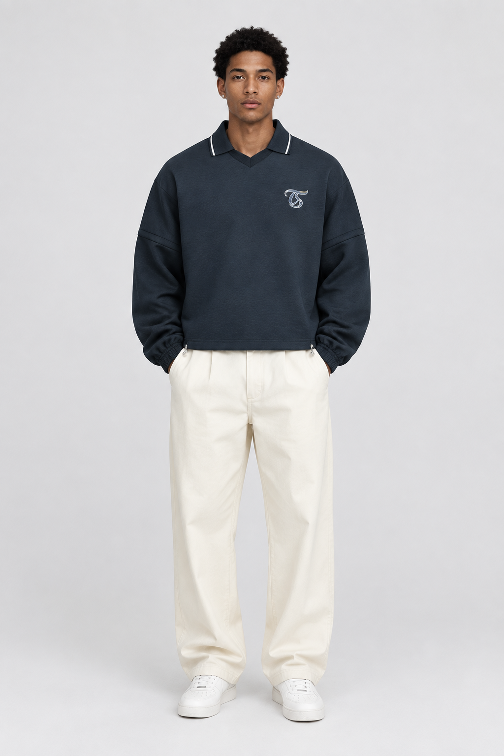 Male model wearing Scorpio unisex boxy collared detachable sweatshirt, front view; illustrative styling image