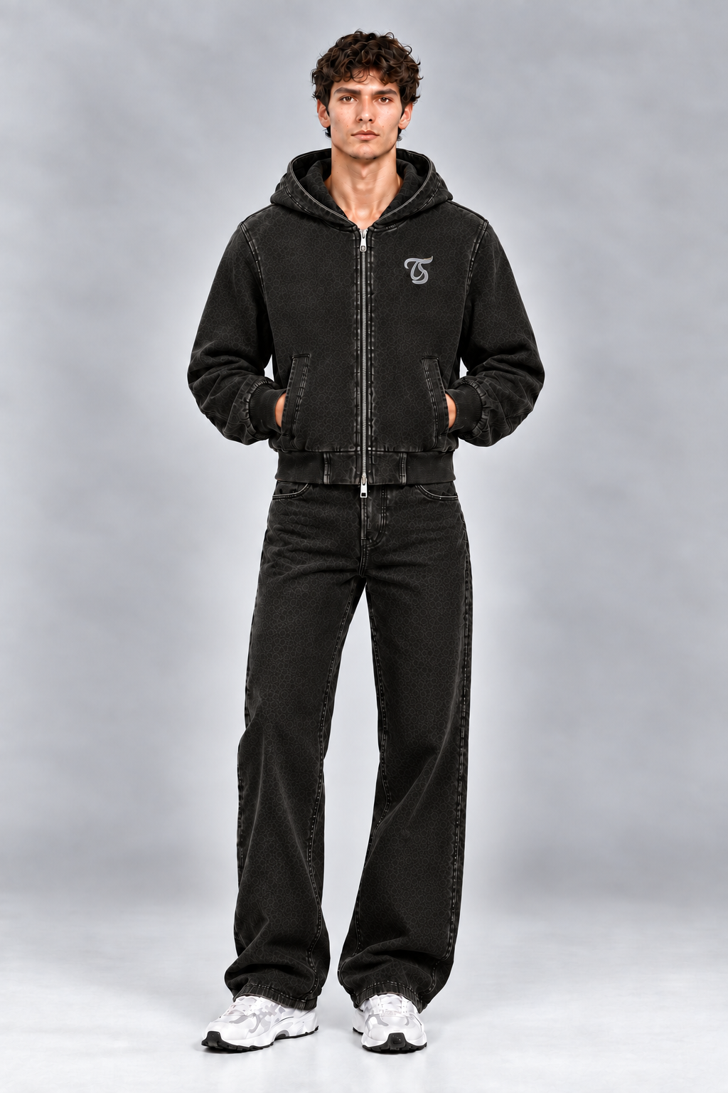 Male model wearing black Pisces vintage wash full zip hoodie with TS logo, front view; print is illustrative