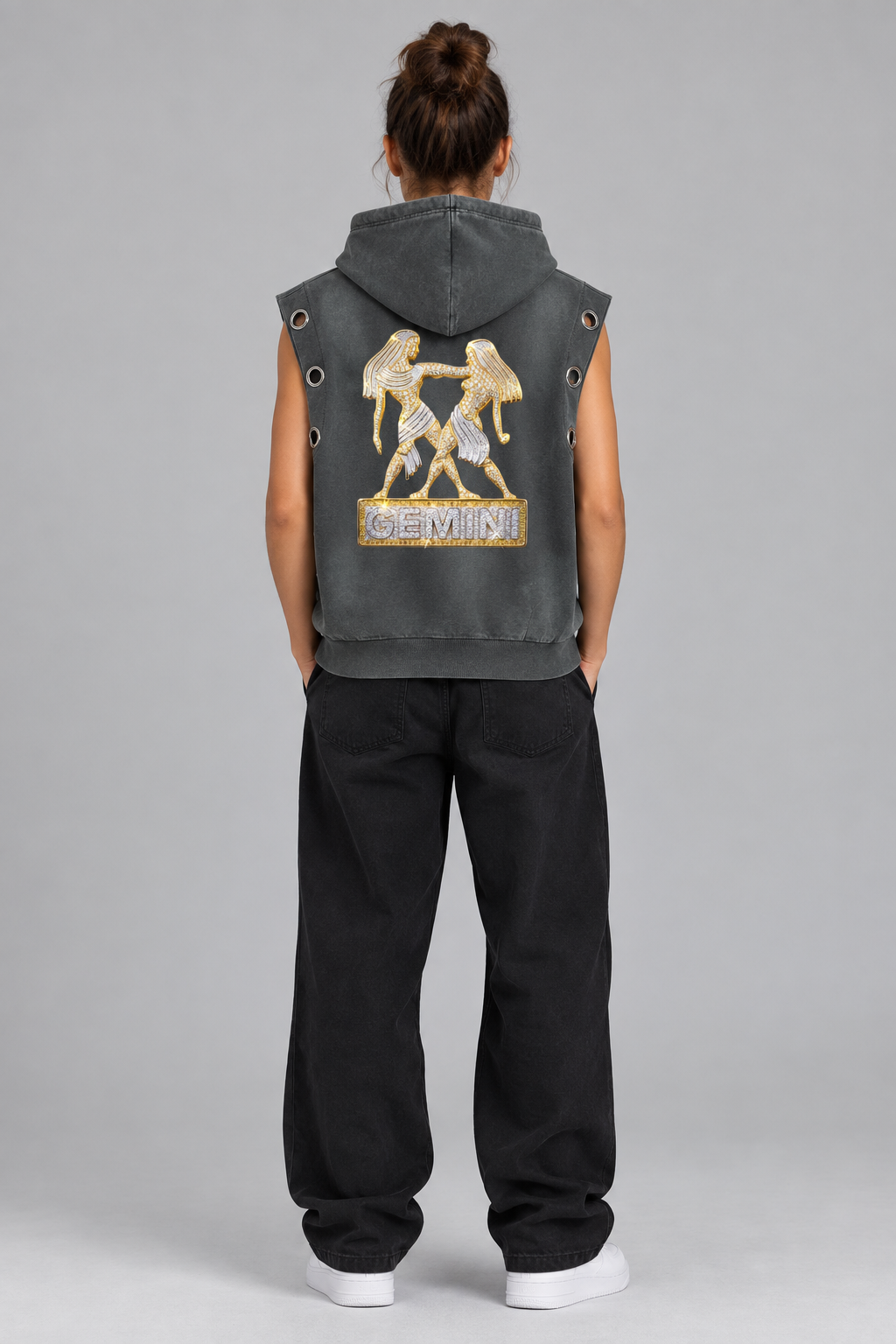Female model wearing gray Gemini sun fade sleeveless hoodie, back twin artwork; illustrative styling photo