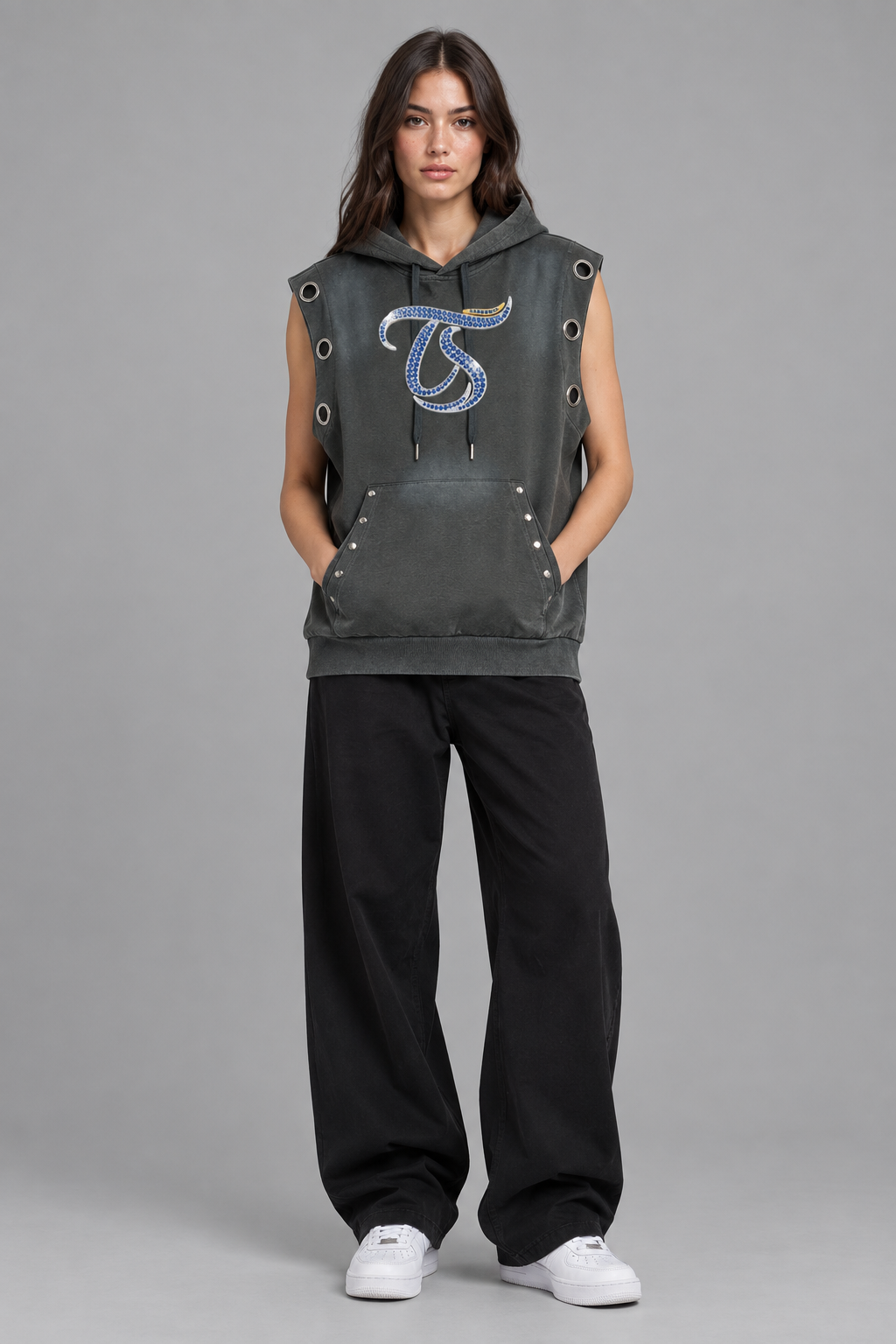 Female model wearing gray Libra sun fade sleeveless hoodie, front chest mark; illustrative styling photo