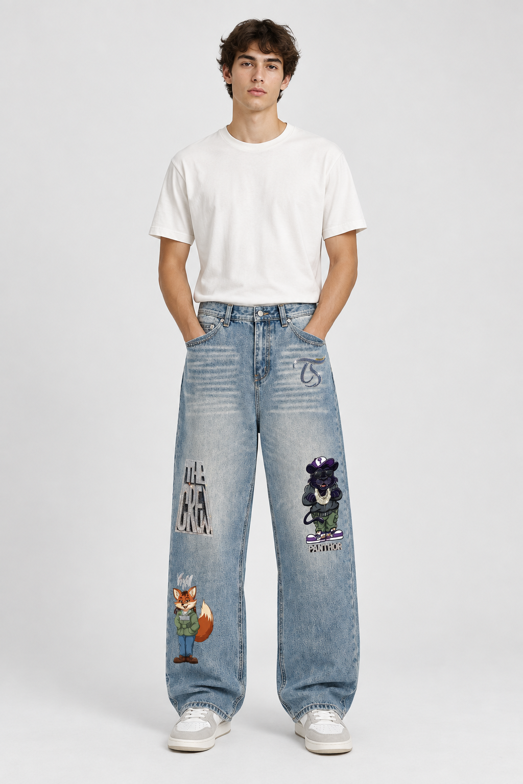 Model wearing The Crew vintage wash denim jeans, front view; graphics are illustrative