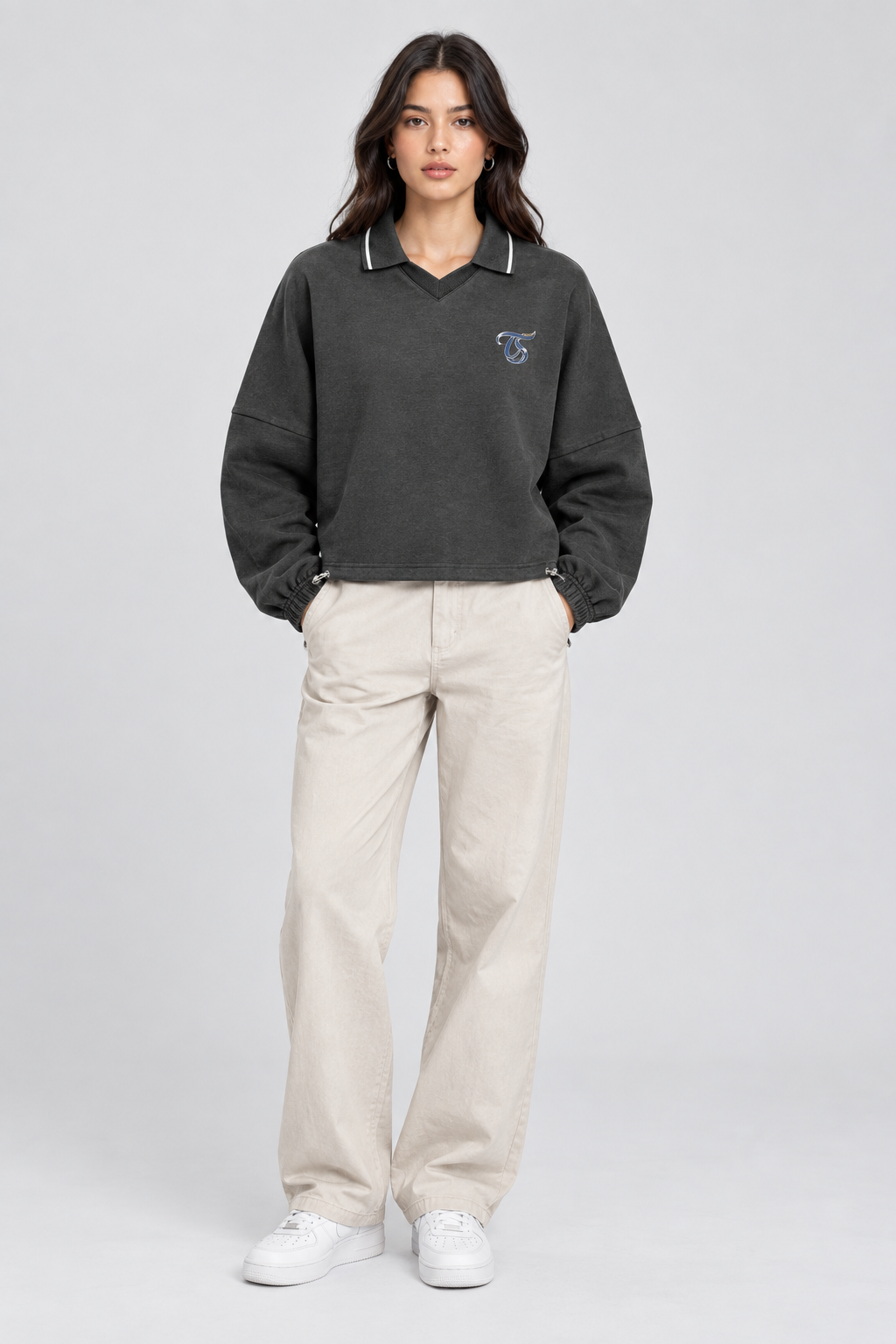 Female model wearing Virgo unisex boxy collared detachable sweatshirt, front view; illustrative styling image