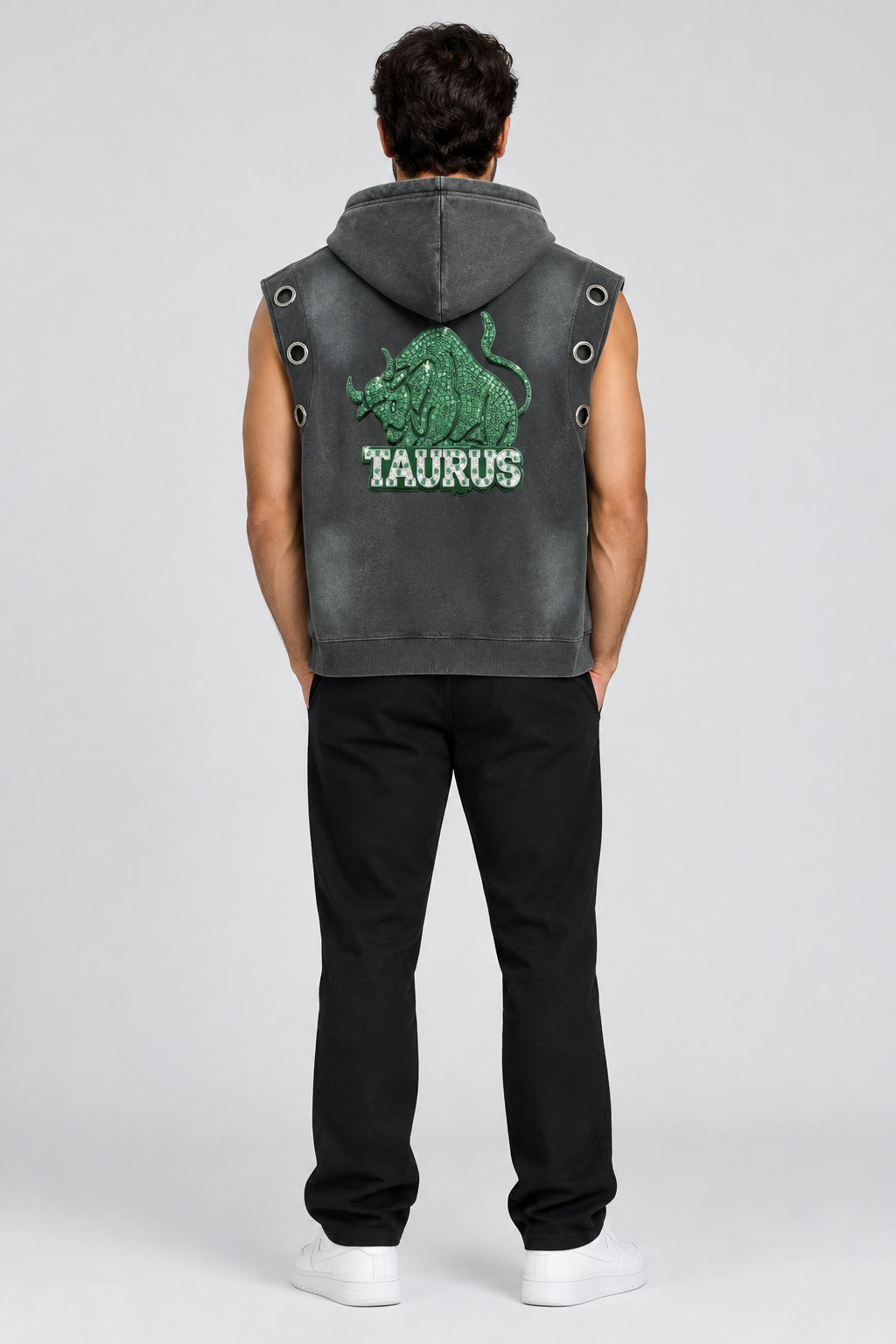 Model wearing Taurus vintage wash sun fade sleeveless hoodie with bull artwork, back view; illustrative styling photo