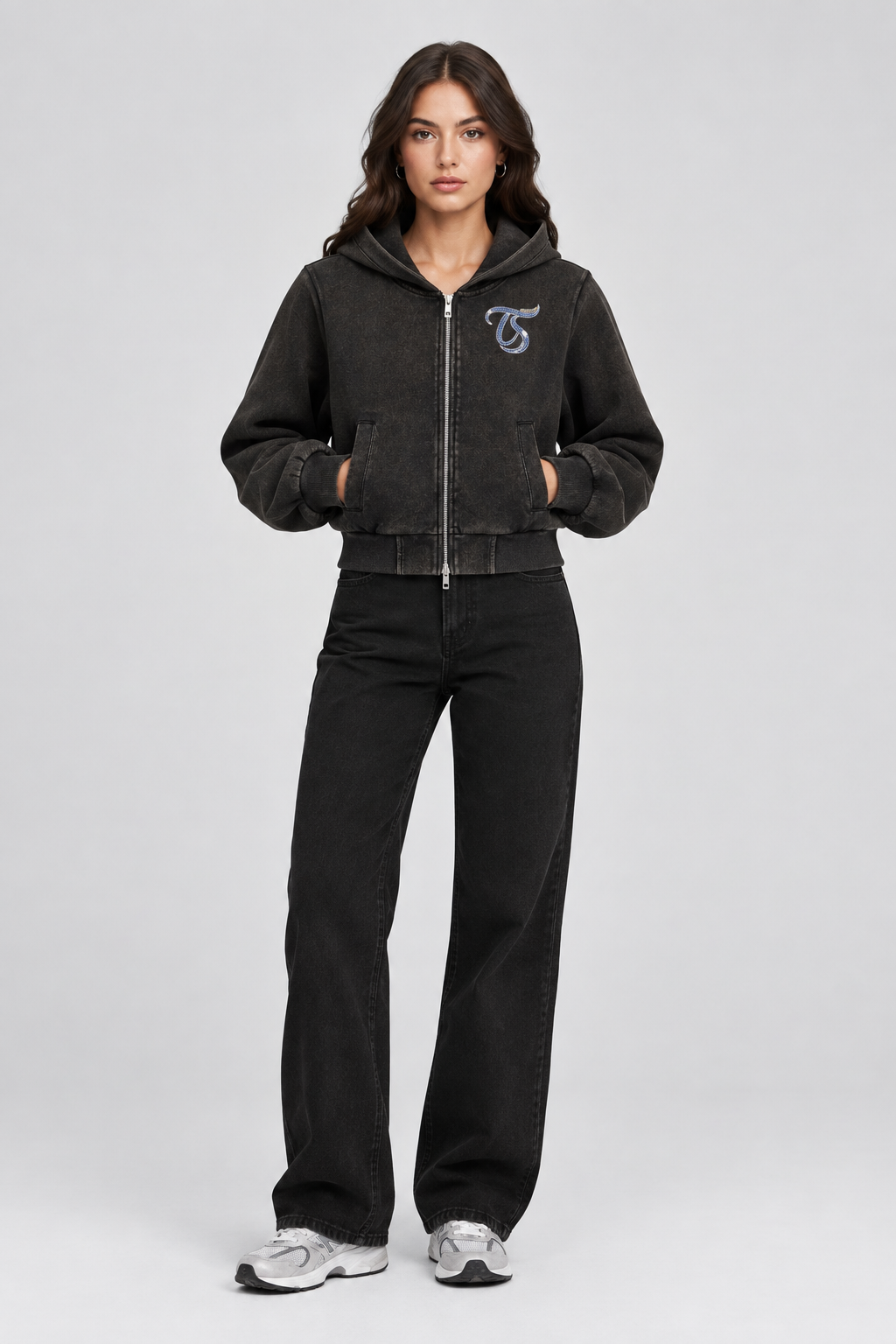 Female model wearing black Aries vintage wash full zip hoodie, front view; print is illustrative