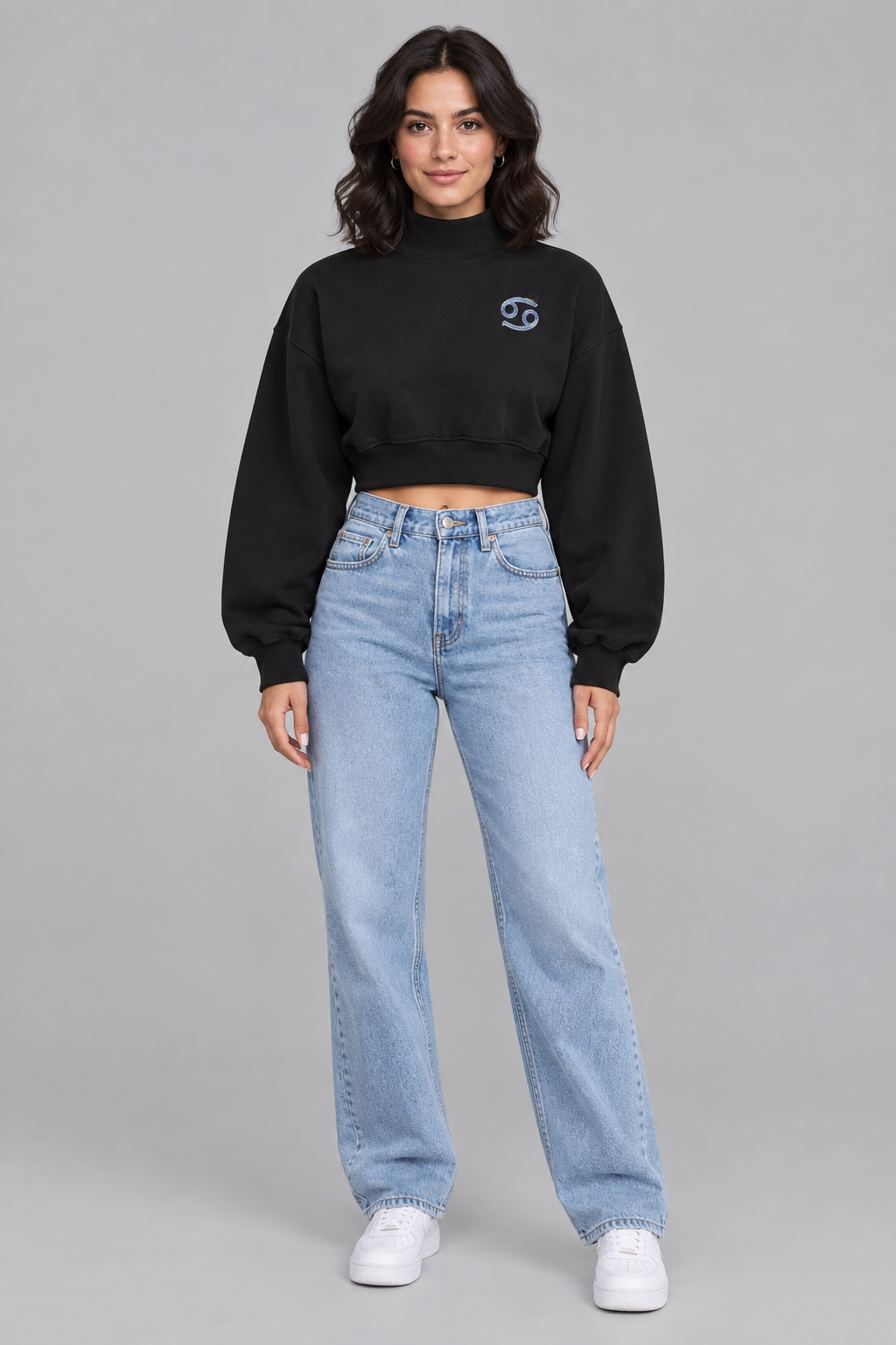 Female model in black Cancer women's crop mock neck sweatshirt, front with small Cancer chest symbol; illustrative print