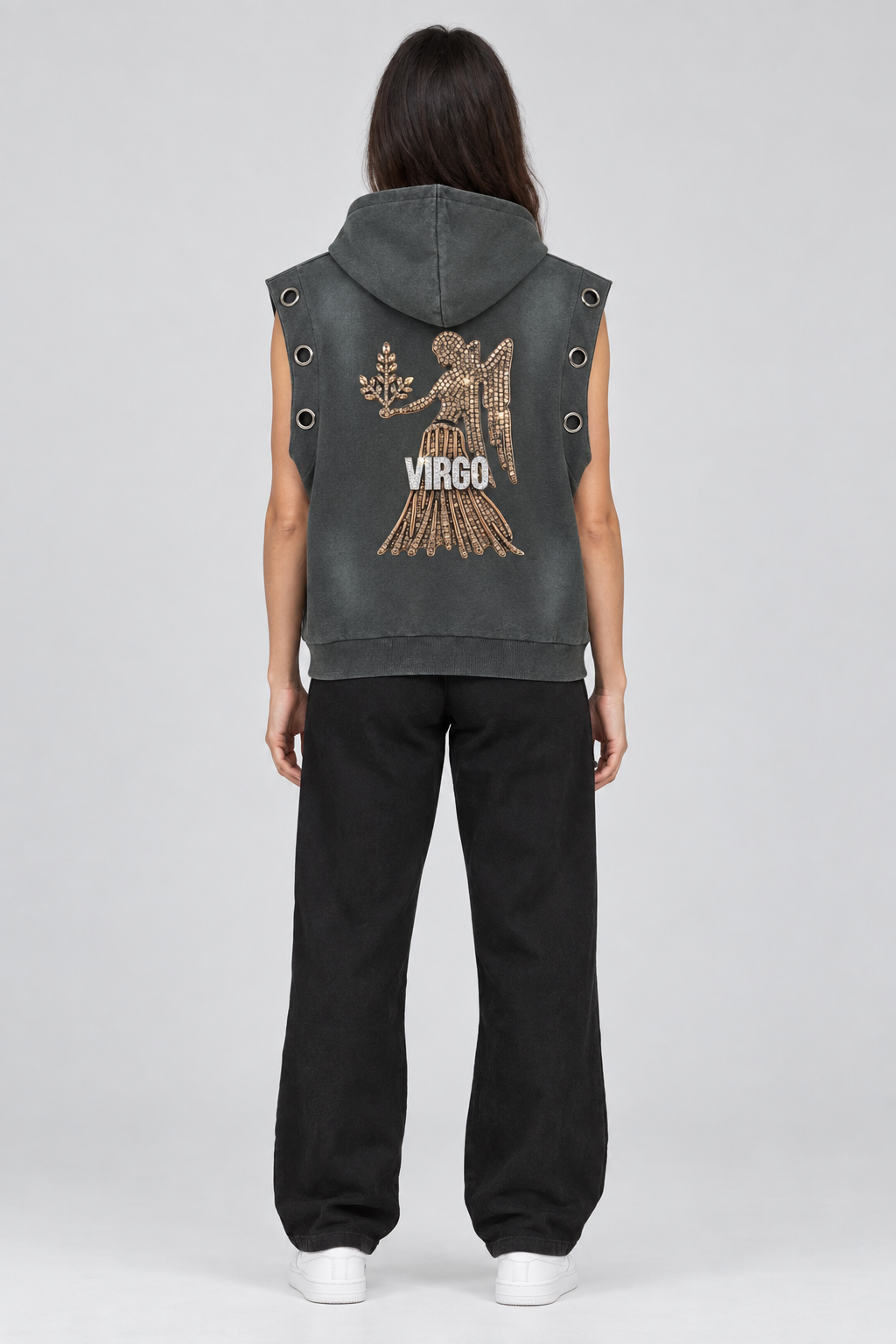 Female model wearing Virgo vintage wash sun fade sleeveless hoodie with Virgo artwork, back view; illustrative styling photo