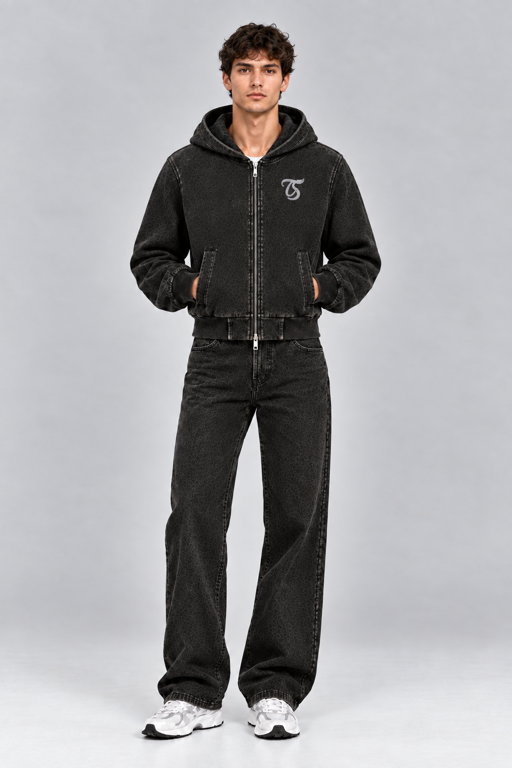 Male model wearing black Scorpio vintage wash full zip hoodie with TS logo, front view; print is illustrative
