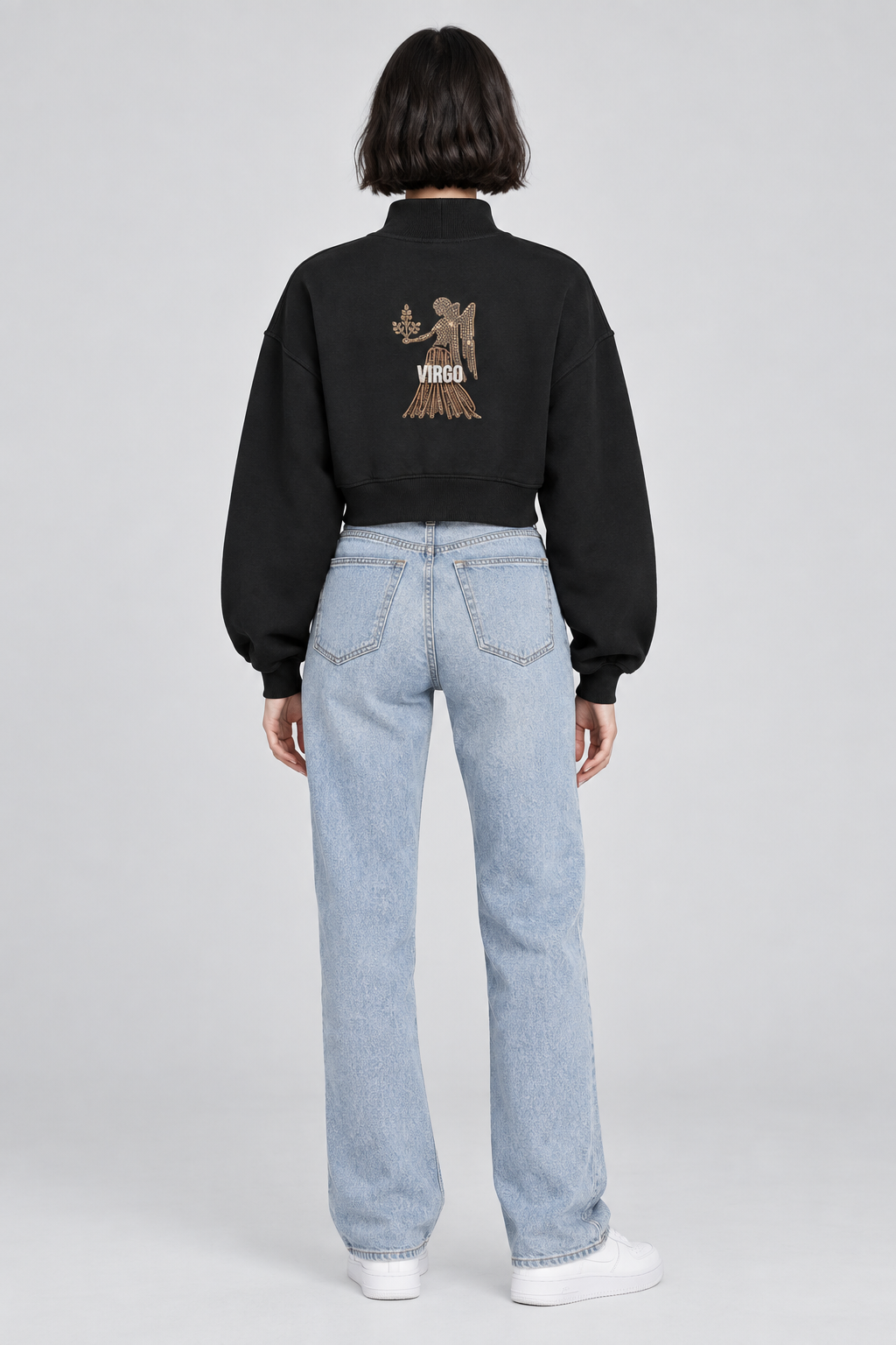 Female model in black Virgo women's crop mock neck sweatshirt, back Virgo figure design; illustrative print