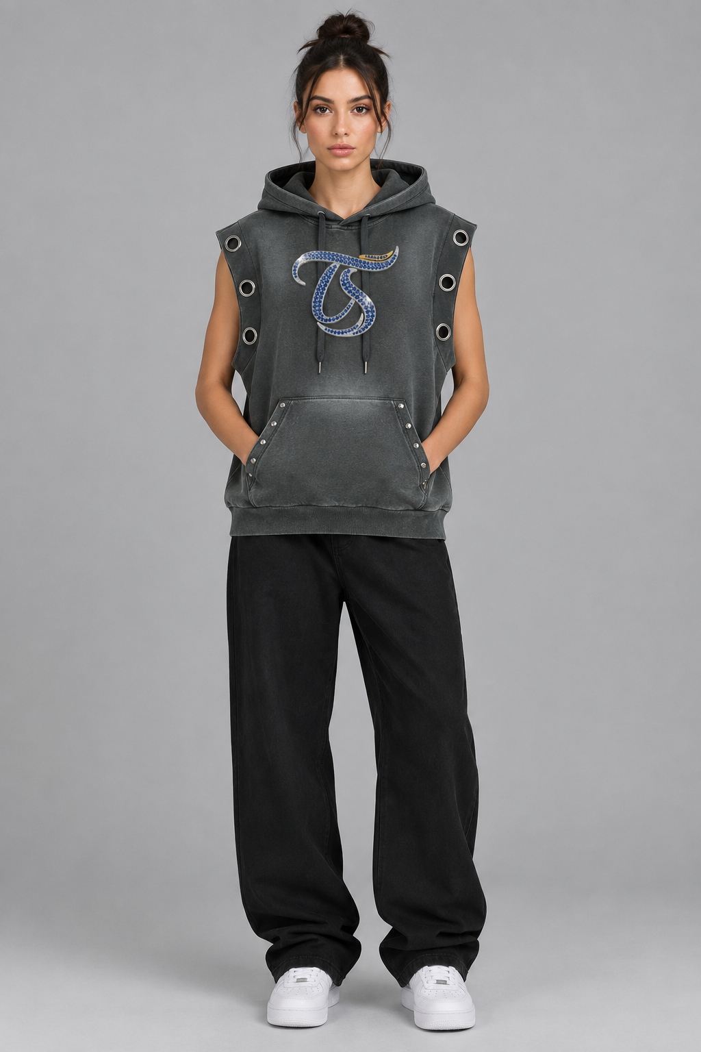 Female model wearing gray Gemini sun fade sleeveless hoodie, front chest mark; illustrative styling photo