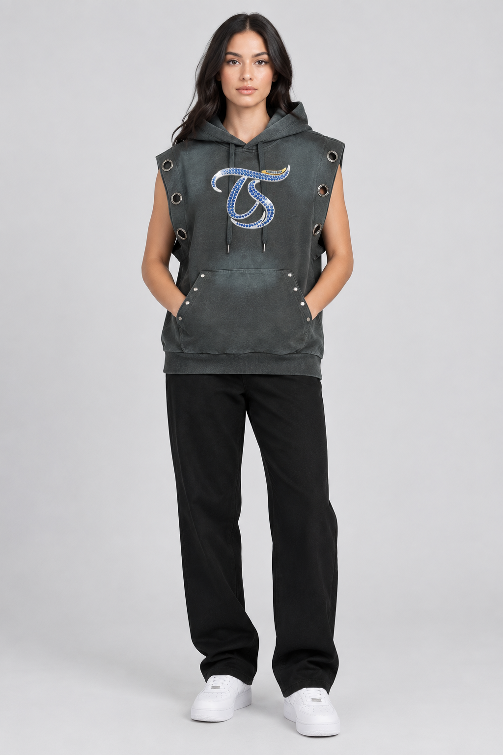 Female model wearing Virgo vintage wash sun fade sleeveless hoodie, front view; illustrative styling photo