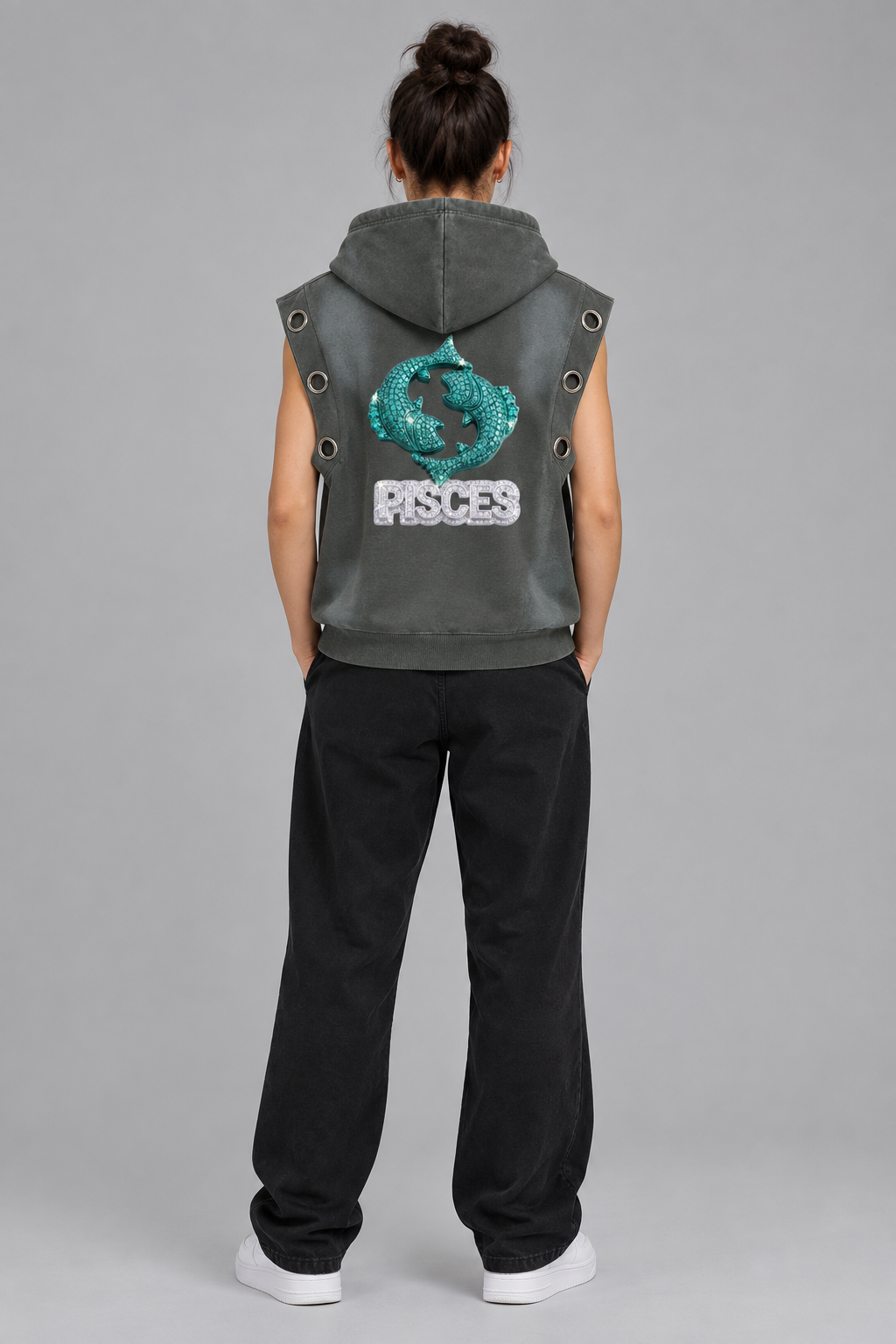 Female model wearing gray Pisces sun fade sleeveless hoodie, back fish design; illustrative styling photo