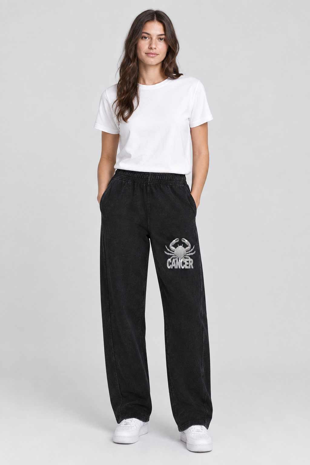 Female model wearing black Cancer mineral wash straight sweatpants, front Cancer thigh art; illustrative print