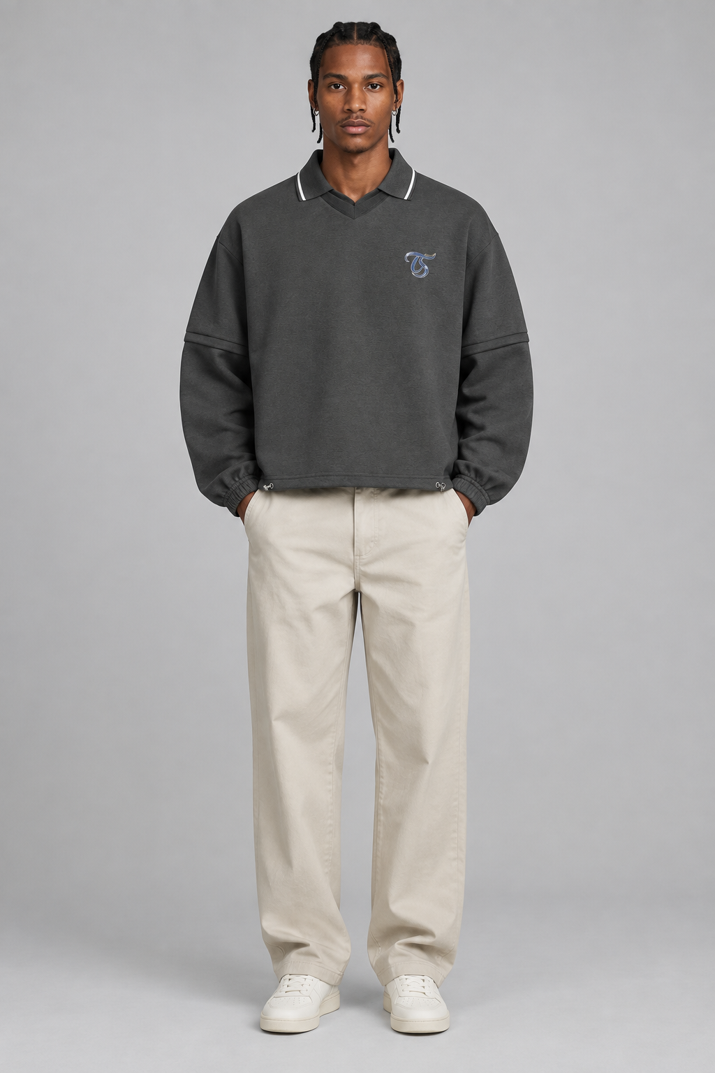 Model wearing Aries unisex boxy collared detachable sweatshirt, front view; illustrative styling image