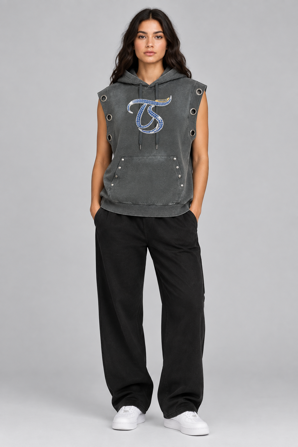 Female model wearing gray Pisces sun fade sleeveless hoodie, front chest mark; illustrative styling photo