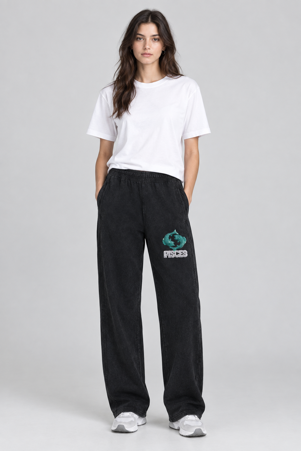 Female model wearing black Pisces mineral wash straight sweatpants with Pisces front thigh design; illustrative print